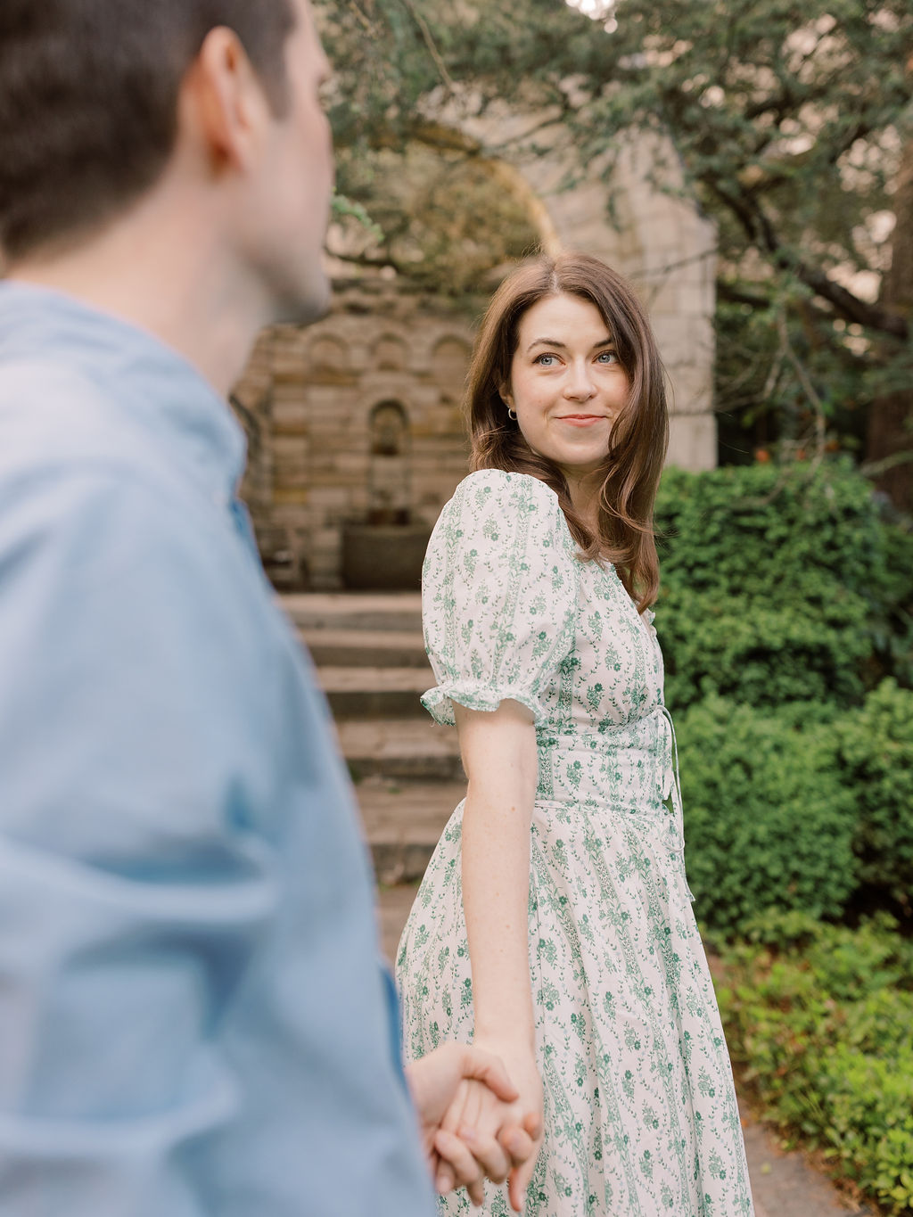 Couple posing in an editorial way at Bishop's Garden, one of the best engagement photo locations in DC.