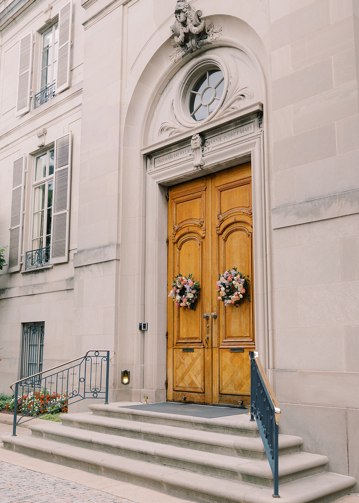 Exterior entrance with floral accent details at a wedding at Meridian House in Washington DC. 