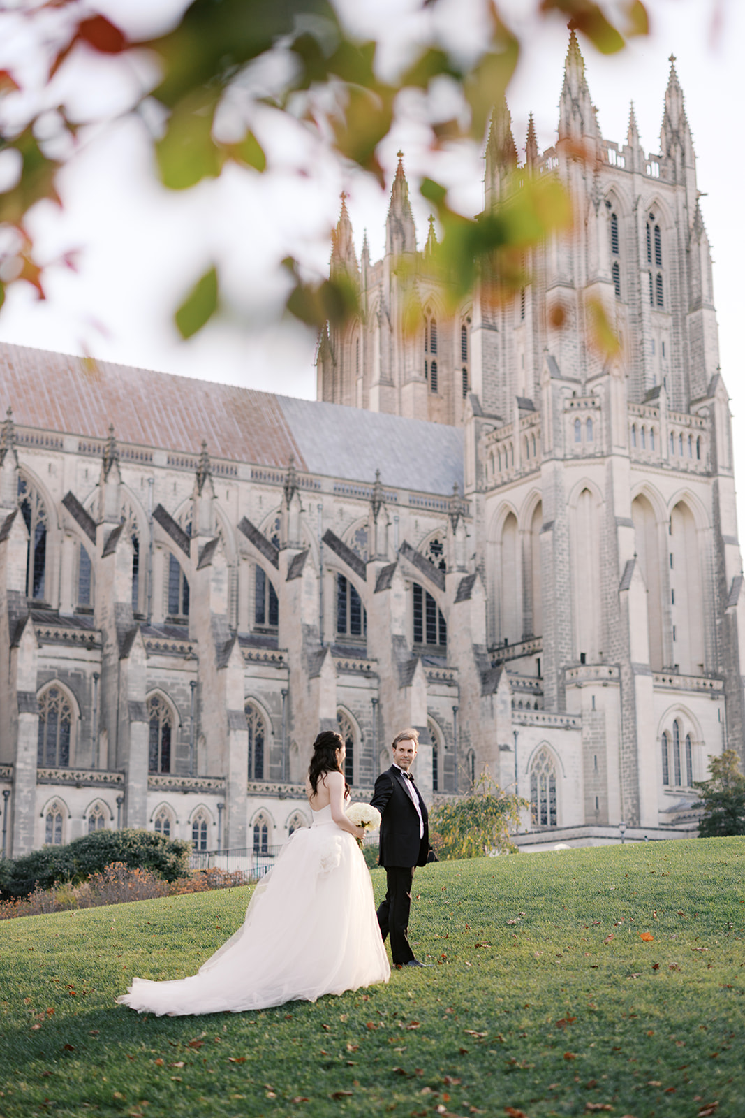 Couple walking at the National Cathedral, one of the best engagement photo locations in DC.