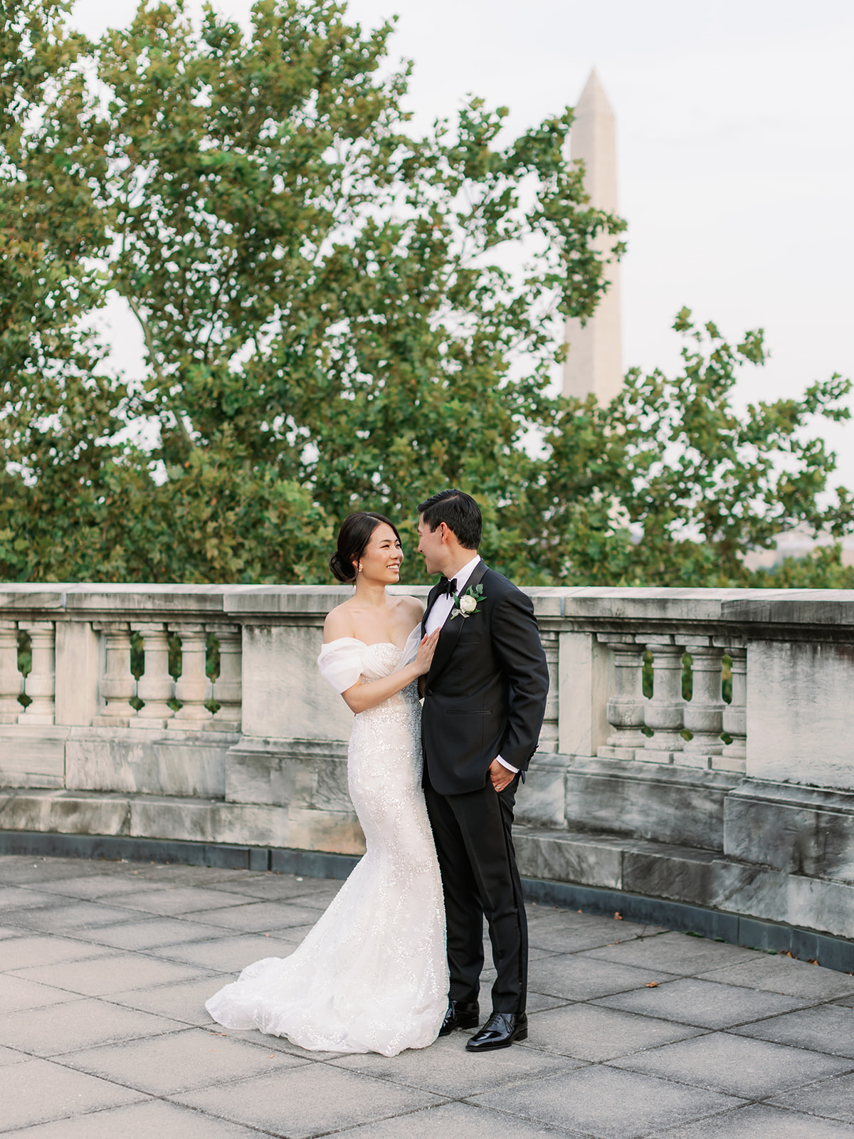 Couple posing on the rooftop of the Daughters of the American Revolution (DAR) wedding venue in Washington DC.