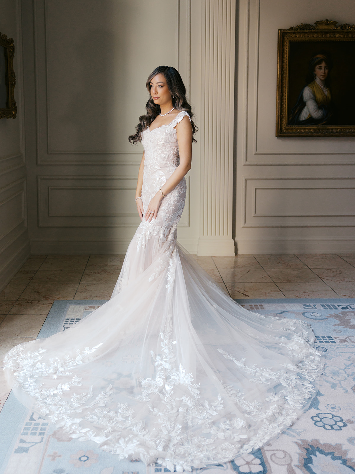 Portrait of a bride from her wedding at the National Museum of Women in the Arts (NMWA) in Washington DC, surrounded by artwork.