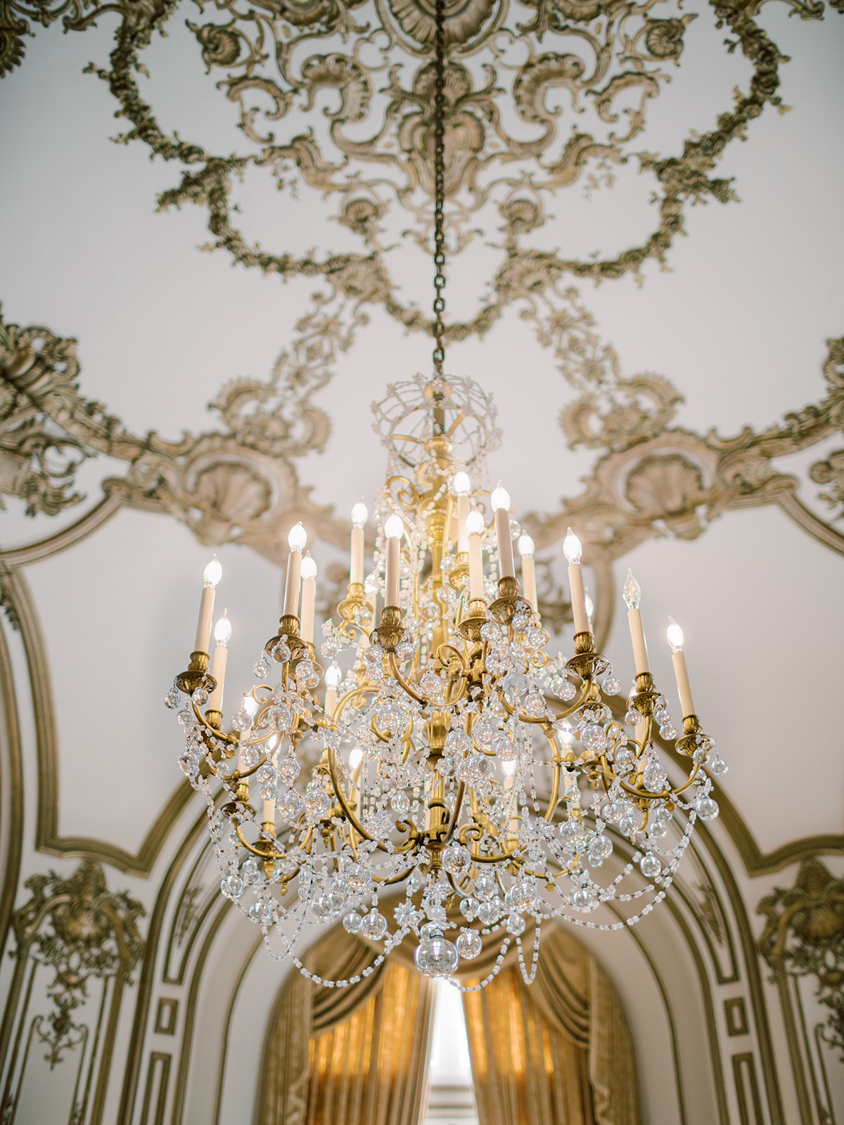 Perry Belmont House Washington DC, detail photo of the interiors, specifically a gold chandelier